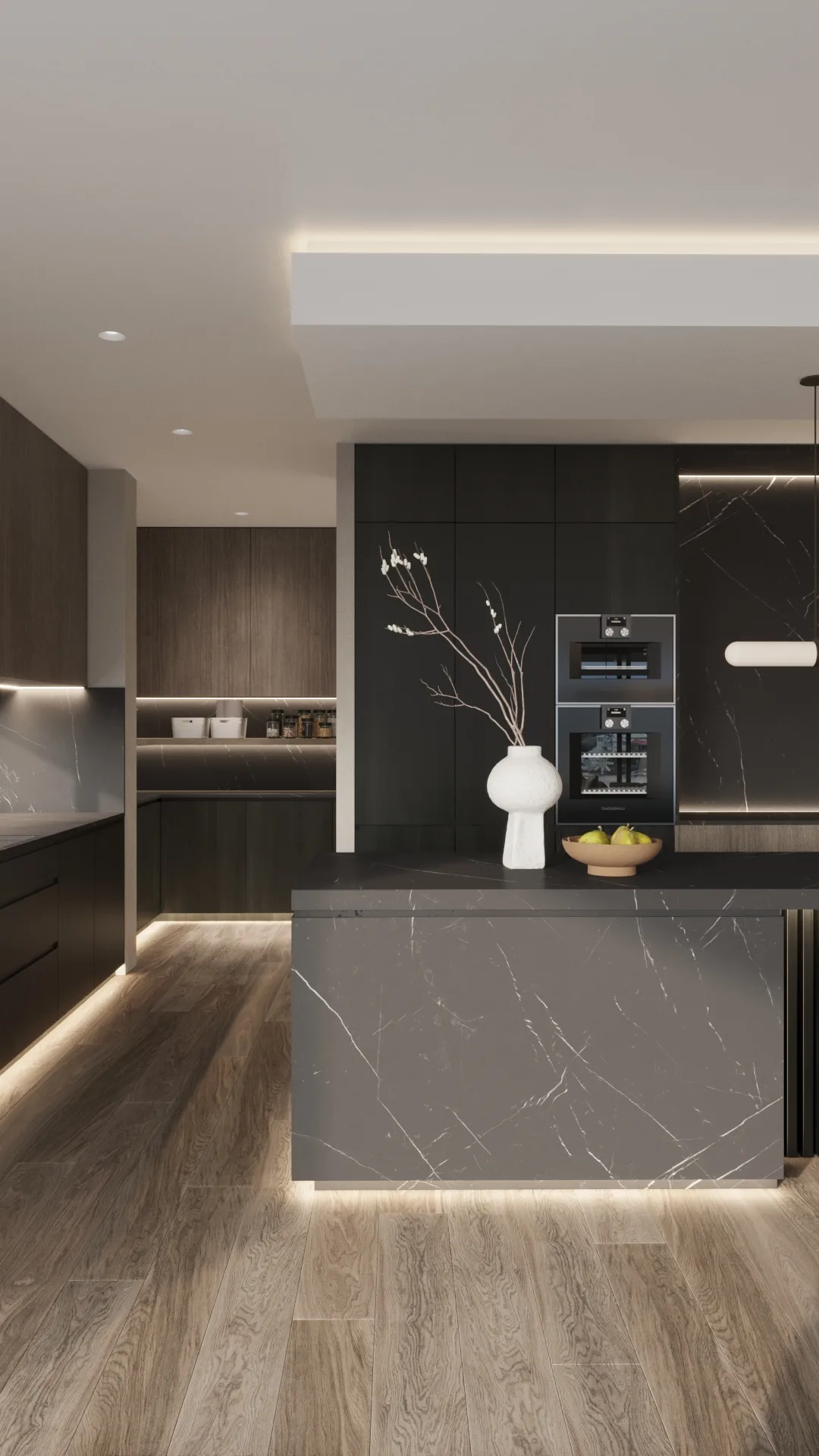 Charcoal kitchen cabinetry and a veined stone island frame stacked black ovens, open shelving and warm floor lighting