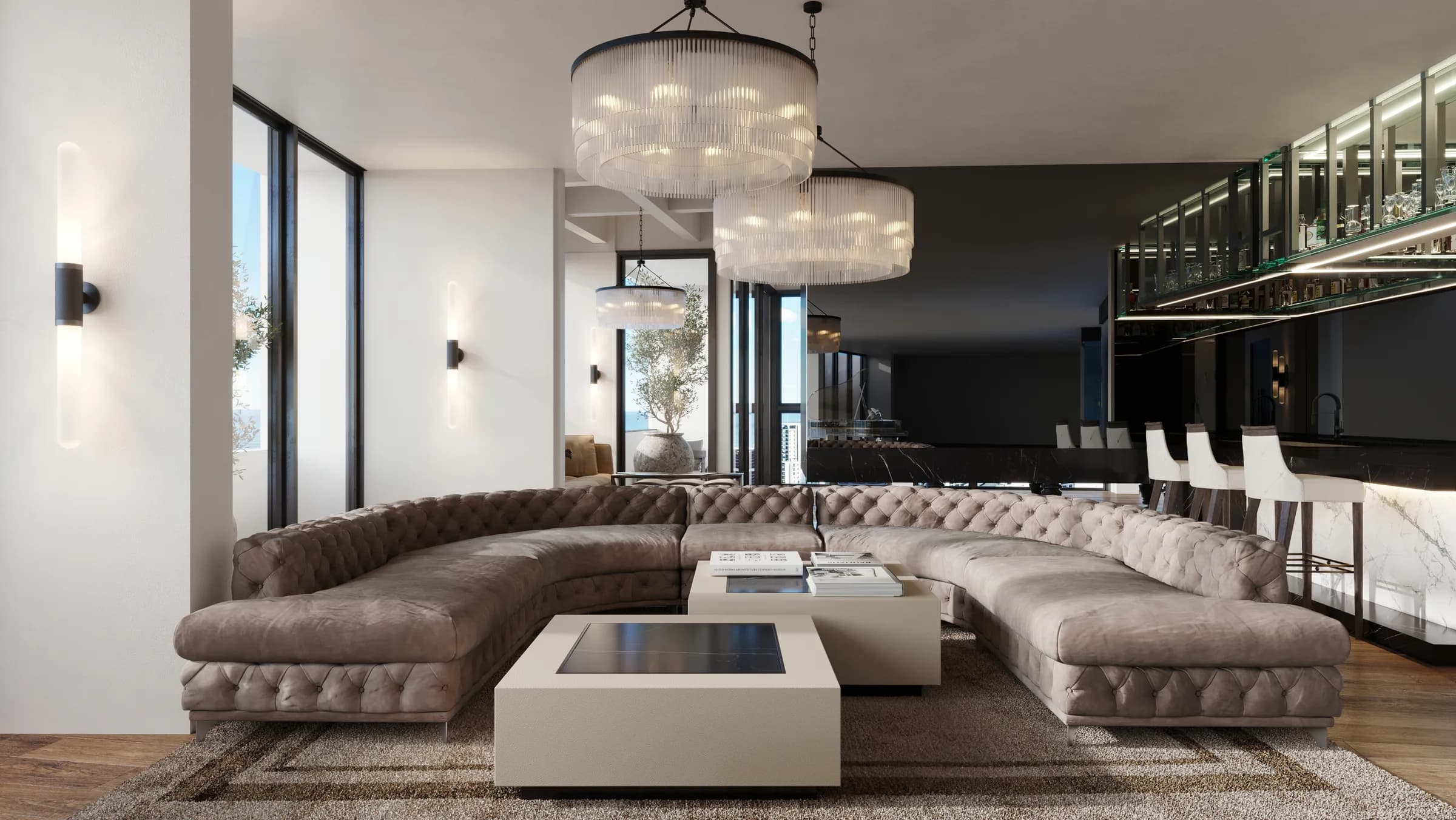 Broadbeach penthouse lounge with a curved custom sofa, tiered glass chandeliers and warm layered light by Luxxe Interiors.