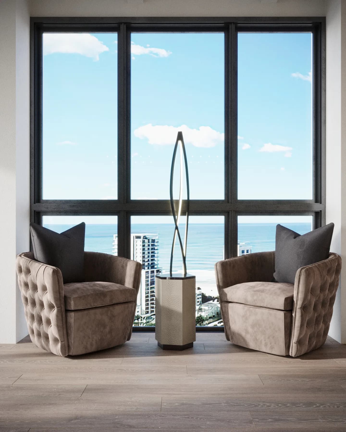 Window nook with two taupe tufted armchairs and a slender sculptural lamp overlooking the ocean
