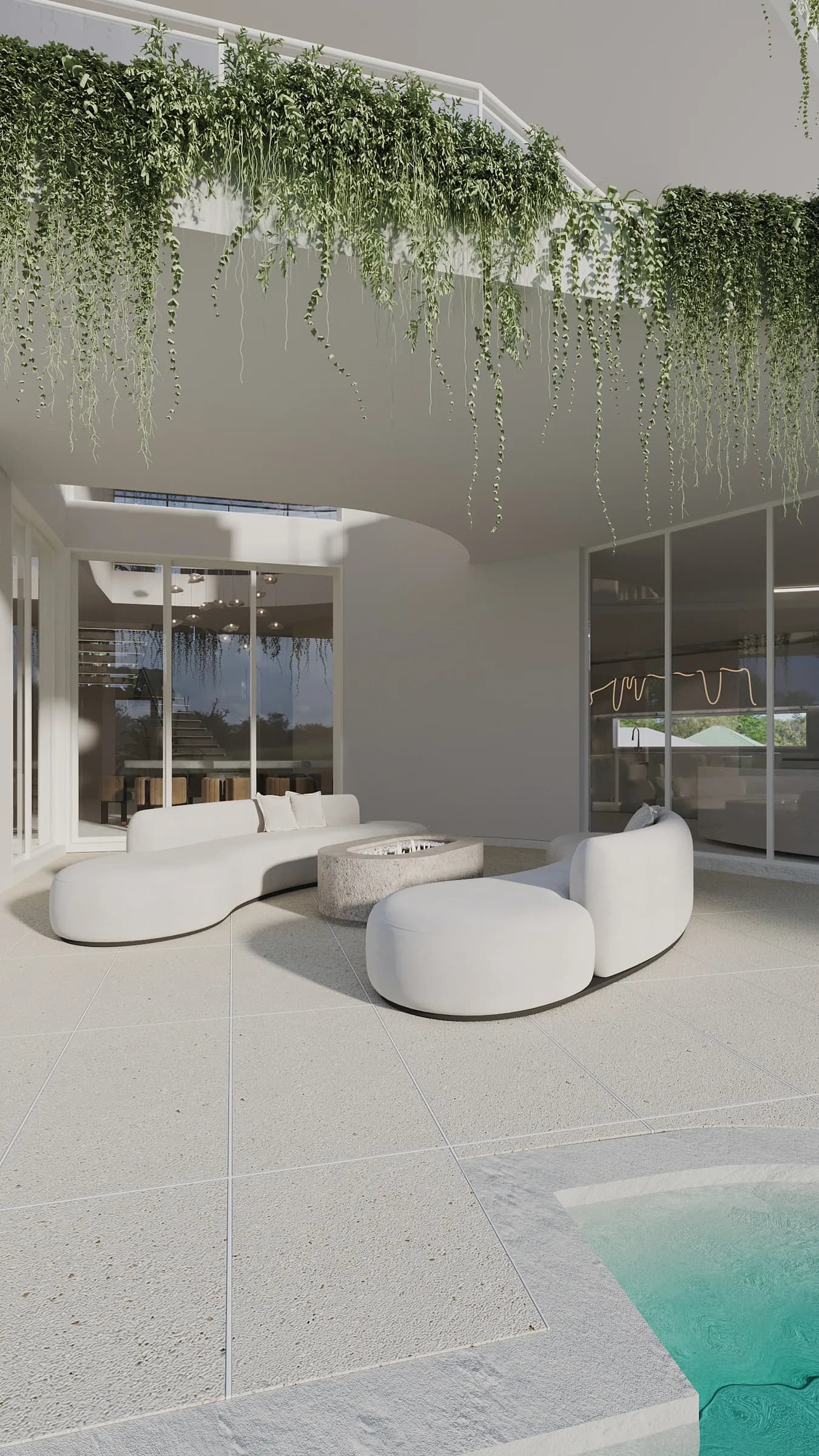 Covered poolside lounge with curved cream seating, a stone fire pit and cascading greenery above the terrace