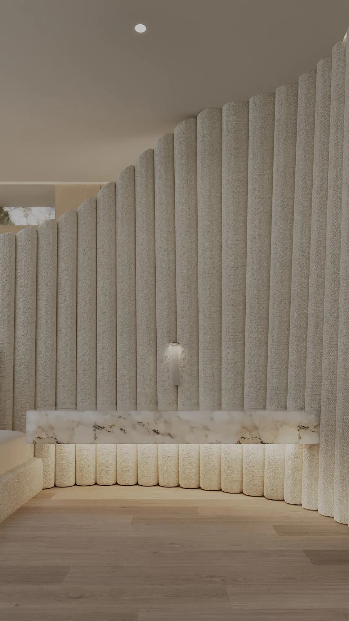 Curved staircase wrapped in vertical upholstered panels, with a veined stone handrail over pale timber flooring