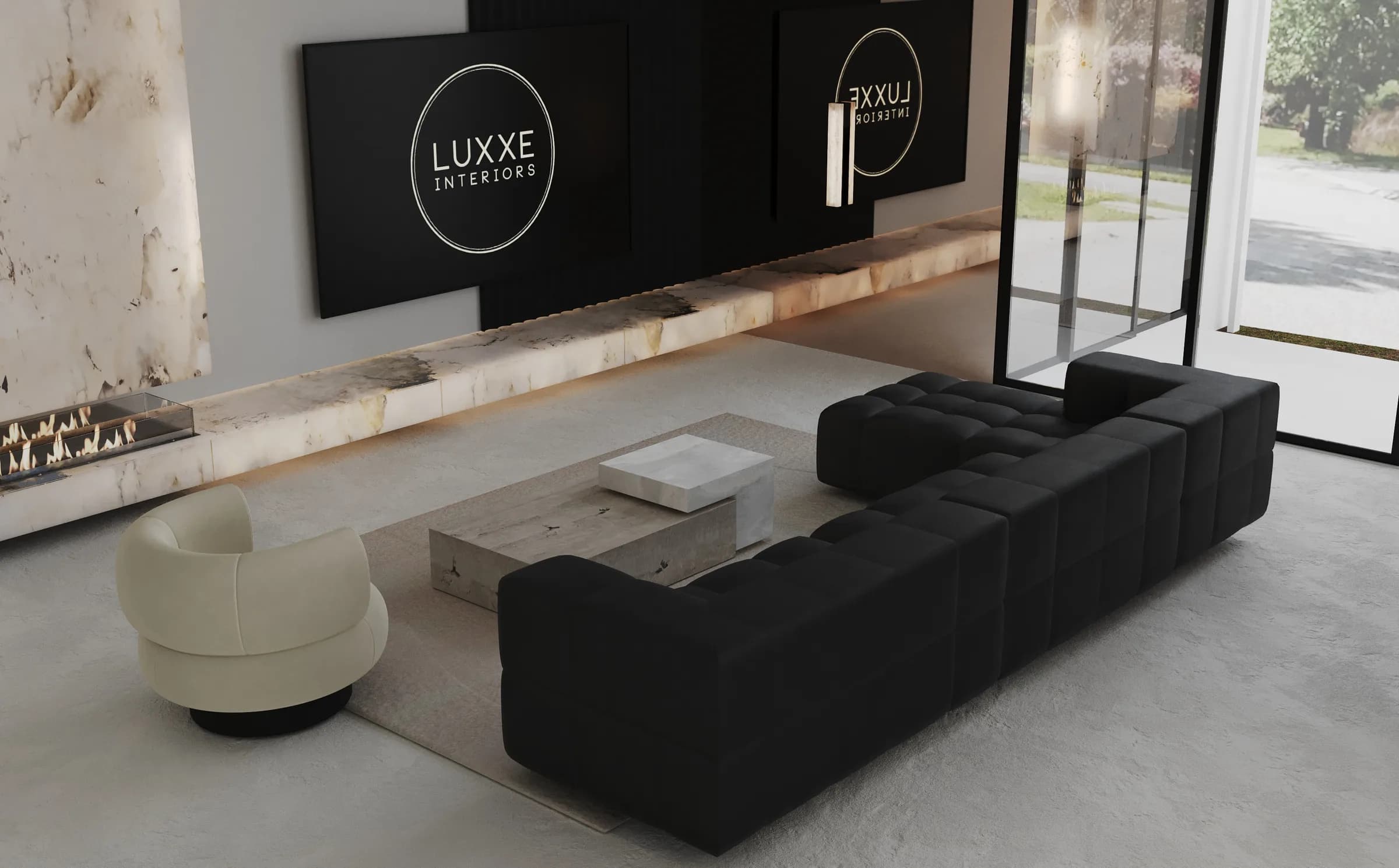 Living room with a black modular sofa, ivory swivel chair, block stone tables and a long marble fireplace