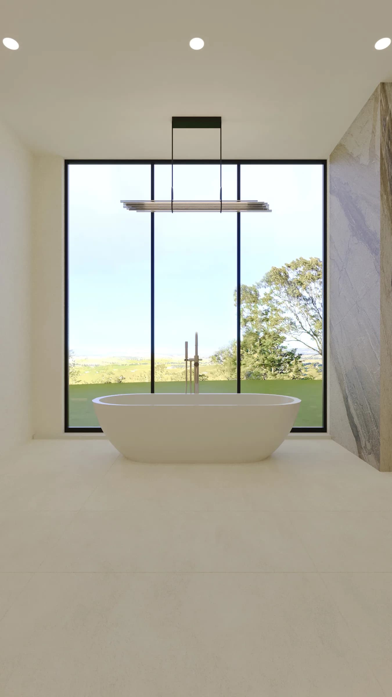 Minimal bathroom with a freestanding oval bath, floor-to-ceiling glazing and a dramatic stone wall overlooking the valley