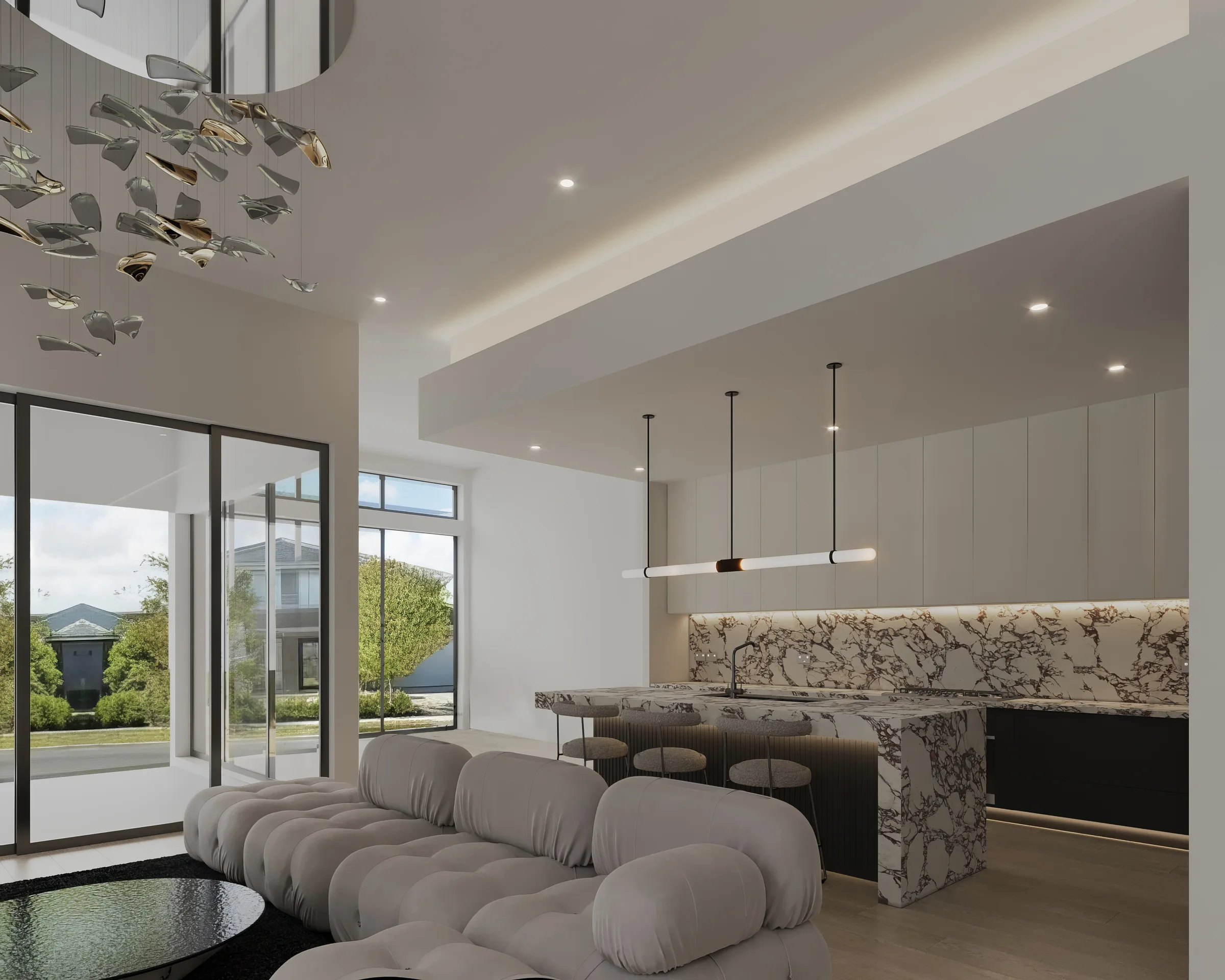 Light-filled kitchen and lounge with a waterfall stone island, sculptural pendant and glazed garden doors