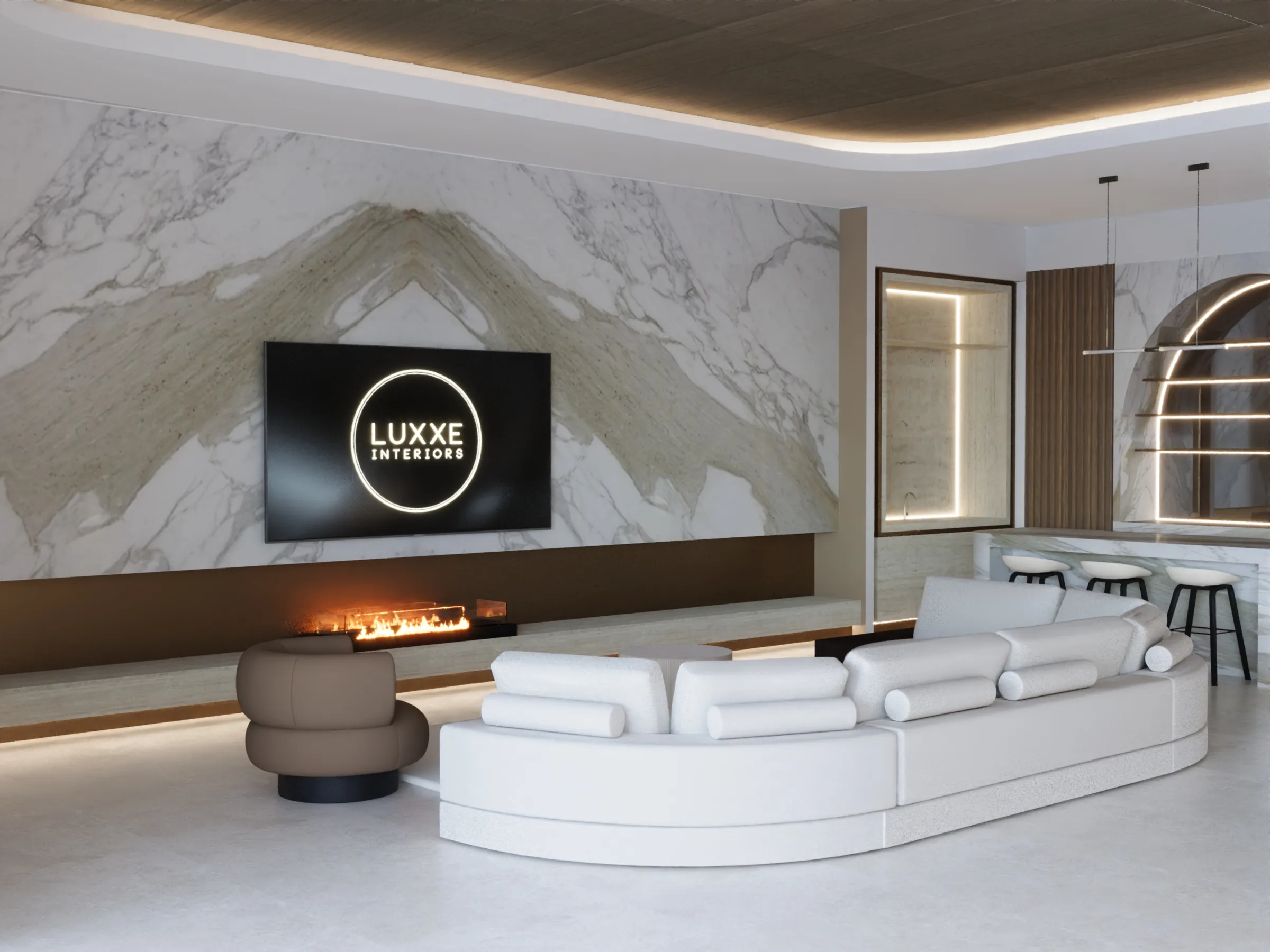 Curved white sofa faces a linear fireplace and bookmatched marble media wall beside the softly lit kitchen bar