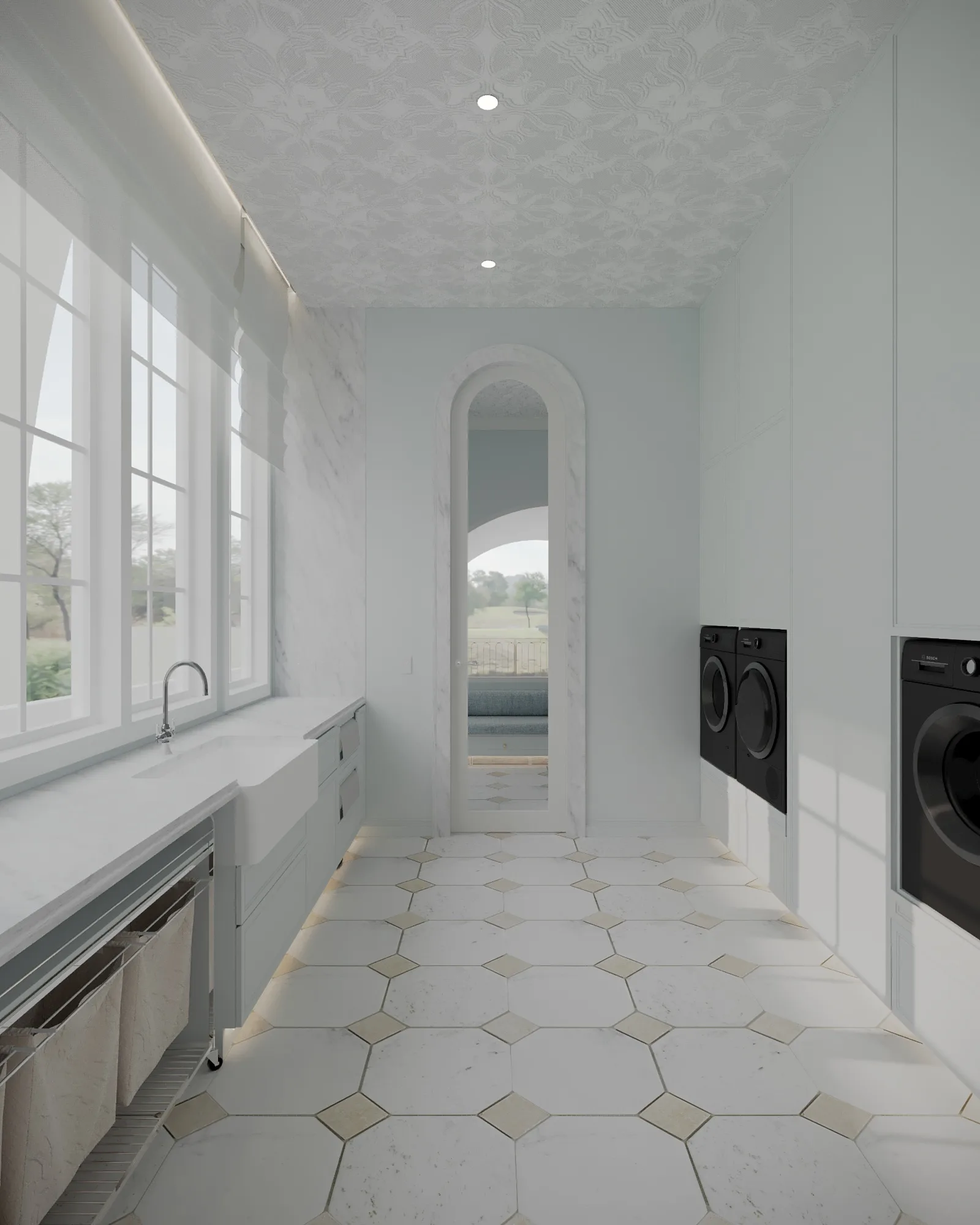 Sunlit laundry with pale blue cabinetry, a farmhouse sink, black appliances and a marble-trimmed arched doorway
