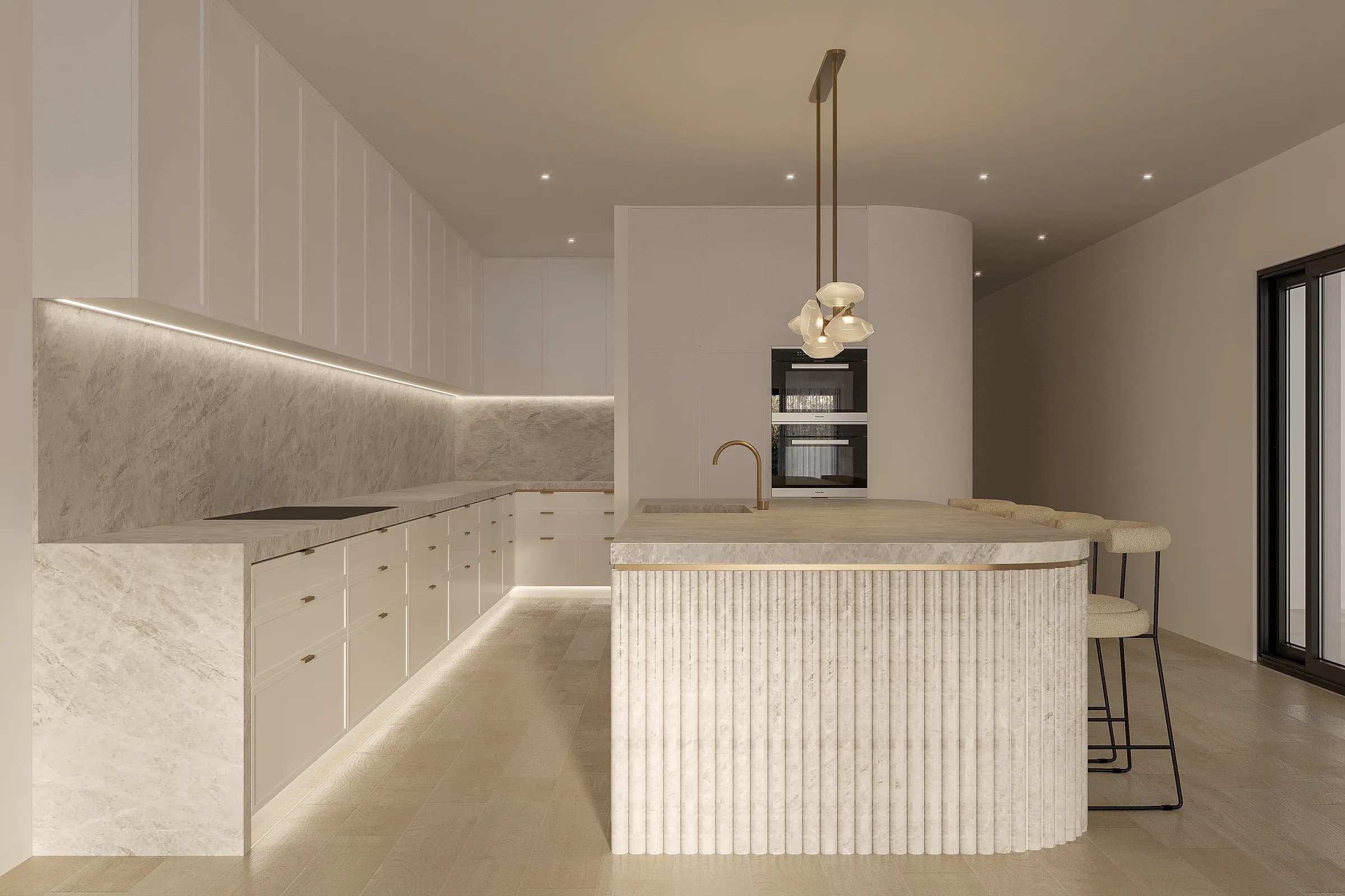 Tonal kitchen with veined stone surfaces, a rounded fluted island and concealed lighting beneath white cabinetry