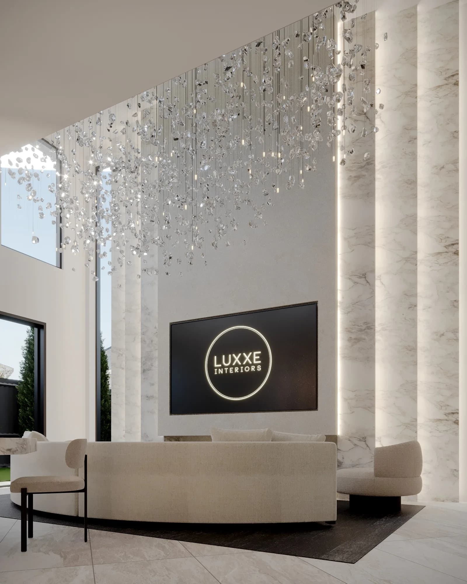 Double-height lounge with a curved cream sofa, lit marble fins and a cascading crystal chandelier